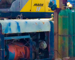 Shapes and hues craft an abstract composition on a dredging barge.