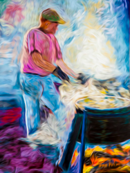 Swirls of steam and smoke dance around the fish boil master.