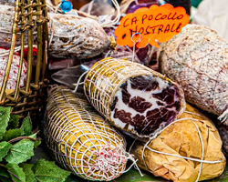 Trussed Italian meats display their pale patinas and marbled textures to entice hungry shoppers.