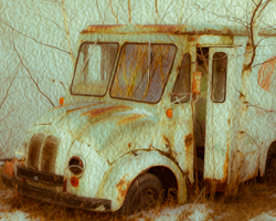 An aging delivery truck sits by the roadside, forgotten and forlorn.