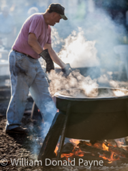 An experienced fish boiler manages a meal awaited by hungry Door County tourists.