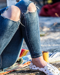 Knee holes add casual style to denim attire.