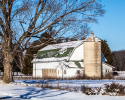 A touch of snow decorates this classic barn.